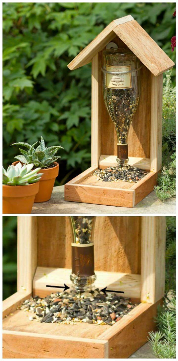 wood and old glass bottle bird feeder