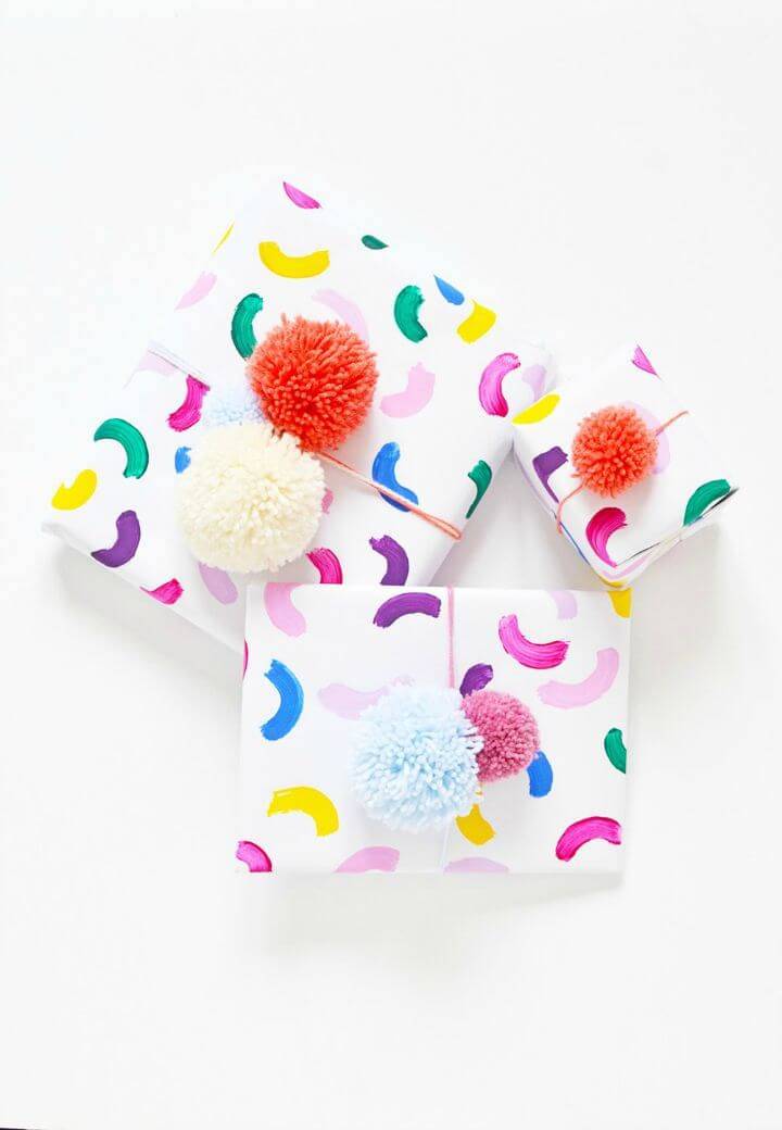 Colorful DIY Gift Wrap with Pom Pom Toppers